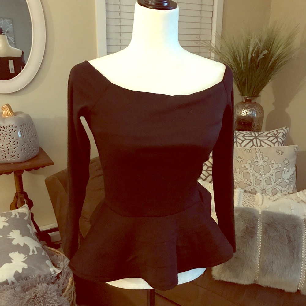 Black peplum top with tags